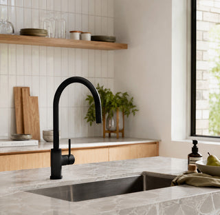 Modern kitchen with black tap and marble countertop