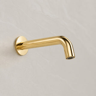 Reno polished gold wall spout tap on white background full view