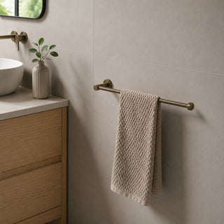 antique brass hand towel holder in a modern bathroom with timber vanity