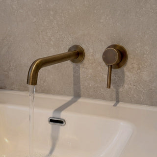 Reno antique brass wall spout tap close-up showing spout detail