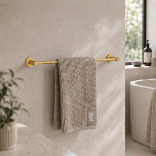 brushed brass towel rail in a modern bathroom with a timber vanity and beige tiles