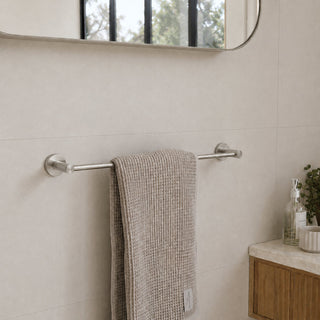 brushed nickel towel bar in a modern bathroom with beige tiles and a timber vanity