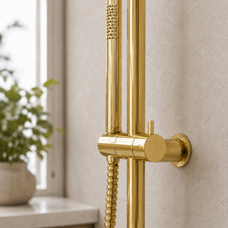 closeup of polished gold shower set