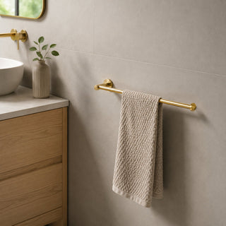 gold hand towel holder in a modern bathroom with timber vanity