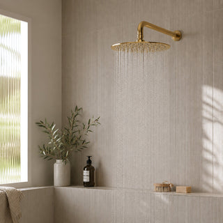 gold rain shower head in modern bathroom