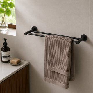 matt black double towel rail in a modern bathroom with a timber vanity and beige tiles