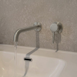 Reno brushed nickel wall spout tap close-up showing spout detail